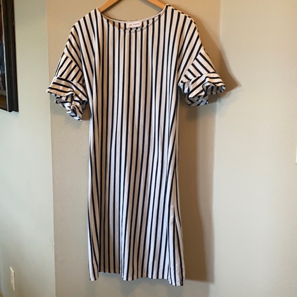 White dress with vertical black stripes.